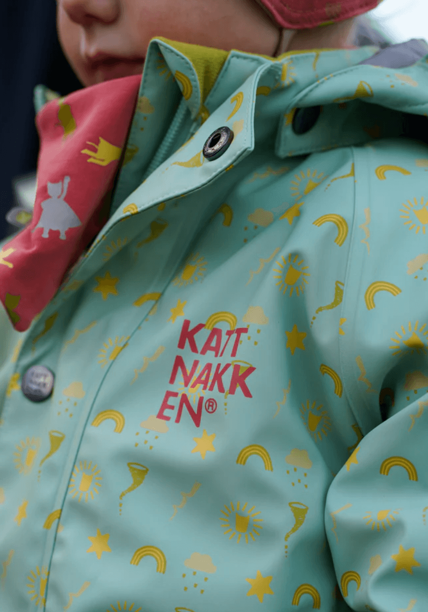 Kattnakken Babyregndress dugg jane pistasj